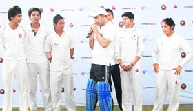 Cricketer Virender Sehwag gives tips to budding cricketers at a selection trial for free admission at the Sehwag International School in Jhajjar on Saturday.