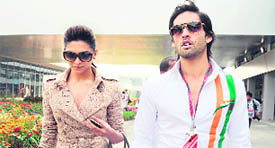 Actress Deepika Padukone (L) and Siddharth Mallya, son of Force India Team Principal Vijay Mallya, arrive for the Formula One Indian Grand Prix on Sunday.