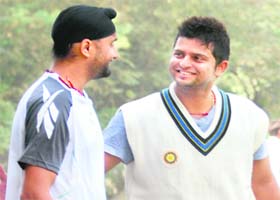 Harbhajan Singh and Suresh Raina at the PCA Stadium in Mohali on Wednesday