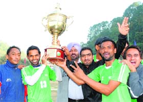 PSEB Patiala team lift the winners trophy in Mandi on Thursday