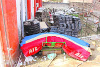 Equipment dumped outside stadium.