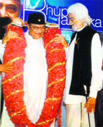 Legendary singer-composer Bhupen Hazarika being greeted by renowned painter MF Hussain on his 75th birthday in Mumbai in July 200. 