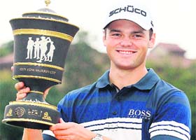 Martin Kaymer of Germany holds the trophy after winning the WGC-HSBC Champions tournament in Shanghai on Sunday