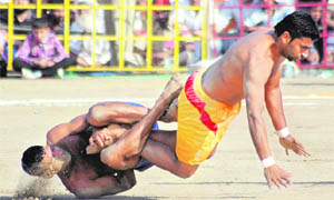 Players of Sri Lanka and Spain in action in Tarn Taran on Monday. 