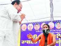 Congress MLA Joginder Pal Jain with Baba Ramdev in Moga