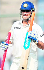 MS Dhoni celebrates after India beat the West Indies during the fourth day of the first Test at the Ferozshah Kotla stadium in New Delhi on Wednesday. India lead the three Test series 1-0