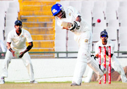 Punjab�s Sandeep Sharma plays a shot during the Ranji Trophy match against Orissa at PCA Stadium, Mohali, on Friday