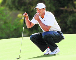Tiger Woods of the US smiles on the 14th hole during the second round of the Australian Open tournament in Sydney on Friday