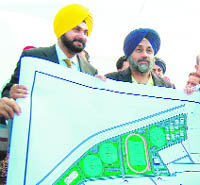 Deputy CM Sukhbir Badal and MP Navjot Sidhu (L) unveil multi-sports complex map in Amritsar. 