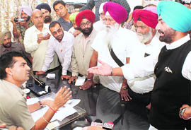 Bholath MLA Sukhpal S Khaira argues with Rajpura SP Manmohan Sharma in Rajpura on Saturday. 
