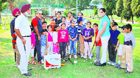 Junior golfers attend a putting session at the Chandigarh Golf Club on Saturday.
