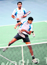 Pakistan�s Aisam-Ui-Haq Qureshi (top) and India�s Rohan Bopanna in action during their double final of the Paris Masters on Sunday. 