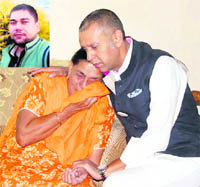 Congress leader Arvind Khanna consoles the mother of the victim ( inset) 