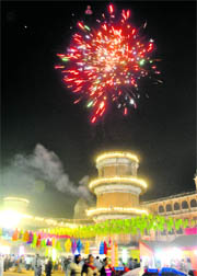 Fireworks above the illuminated Sheesh Mahal on the concluding day of the crafts mela in Patiala on Monday. 