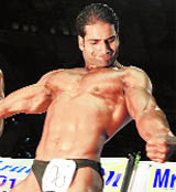 A bodybuilder flexes his muscles during the Mr Kashmir Bodybuilding Championship in Srinagar on Monday.