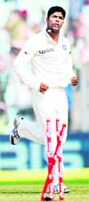 Umesh Yadav (R) celebrates after taking the wicket of West Indies� Shivnarine Chanderpaul (L) during the fourth day of the second Test at The Eden Gardens in Kolkata on Thursday. India now lead the 3 match Test series 2-0. 