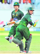 Pakistan's Imran Farhat (R) and Mohammad Hafeez in action during the 3rd ODI against SL in Dubai on Friday. 