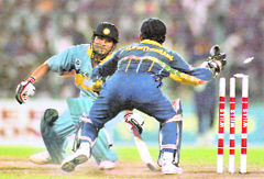 A file photo of the 1996 World Cup semifinal shows Sachin Tendulkar (L) being stumped by Sri Lankan wicketkeeper Romesh Kaluwitharna. 
