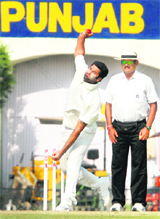 Punjab�s Manpreet Gony bowls during their Ranji Trophy match against Saurashtra at the PCA Stadium in Mohali on Friday.