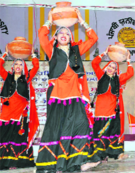 Girls perform a folk dance during the Golden Jubilee celebrations of Punjabi University, Patiala. 