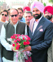 Former Pakistan Prime Minister Shujaat Hussain being welcomed by former minister Bikram Singh Majithia (right) at the Attari-Wagah border on Sunday.