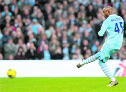 Manchester City's Mario Balotelli scores against Newcastle United in Manchester on Saturday