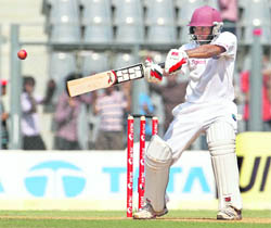 West Indies batsman Adrian Barath cuts on the opening day of the third Test against India at the Wankhede Stadium in Mumbai on Tuesday. 