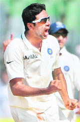 India�s off-spinner R Ashwin celebrates after taking a wicket in Mumbai on Tuesday. 