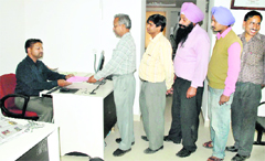Consumers queue up at the customer care centre in Patiala.