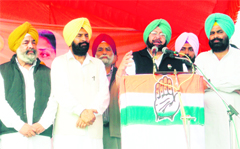 Capt Amarinder Singh addresses a rally at Rajasansi on Wednesday. 