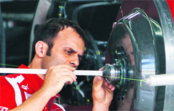 A Ferrari engineer adjusts the front axle of a car in Sao Paulo on Friday ahead of the Brazilian Formula One GP. 