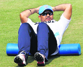 Virender Sehwag stretches during a practice session ahead of their first ODI against the West Indies in Cuttack on Monday. Match Starts: 2.30 pm.