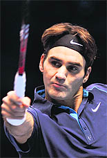 Roger Federer returns against Jo-Wilfried Tsonga in the ATP World Tour Finals in London on Saturday. Federer won a record sixth ATP World Tour Finals title with a 6-3, 6-7 (6/8), 6-3 victory,. With this he moved ahead of Pete Sampras and Ivan Lendl on the list of Tour Finals champions in the 100th final of his majestic career.