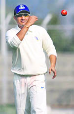 Bengal�s captain Sourav Ganguly throws a ball during their Ranji Trophy match against Haryana in Rohtak
