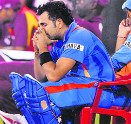 Rohit Sharma (C) reacts sitting outside the boundary during the first ODI between India and West Indies at the Barabati Stadium in Cuttack on Tuesday. India won by 1 wicket.