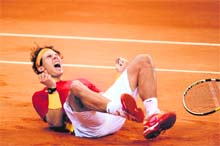 Spain's Rafael Nadal celebrates after winning against Argentina's Juan Martin Del Potro during the Davis Cup final fourth match in Seville on Sunday. Nadal beat Del Potro 1-6, 6-4, 6-1, 7-6
