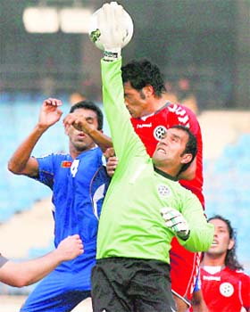 Afghanistan's goalkeeper Bashir Ahmad Darman jumps to make a save against Sri Lanka in New Delhi on Monday. Afghanistan won 3-1