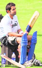 Gautam Gambhir checks out his bat at a practise session in Indore on Wednesday