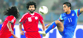 Sunil Chhetri controls the ball as Afghanistan players look on during their final match of the SAFF Championship in New Delhi on Sunday. India won 4-0.