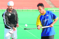 Sher Singh and Jiwa Mohan during a practice camp for World Series Hockey at the Sector 42 Hockey Stadium in Chandigarh on Wednesday.
