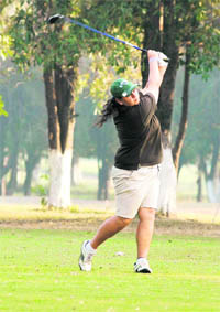 A golfer in action at the Chandigarh Golf Club on Thursday.