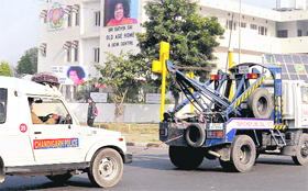 A police Gypsy, which broke down during the Municipal Corporation elections duty, being towed away at Sector 29-30 dividing road in Chandigarh on Saturday. 