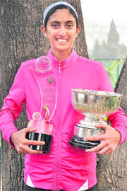 Aditi Ashok poses with her trophies at the Chandigarh Golf Club on Sunday. 