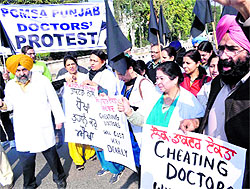 Punjab Civil Medical Services doctors take out a rally in Patiala on Wednesday