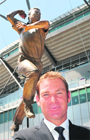 Shane Warne stands in front of a statue of himself unveiled outside the Melbourne Cricket Ground on Thursday. 