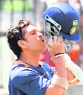 Sachin Tendulkar holds his helmet during training at the MCG in Melbourne on Friday.