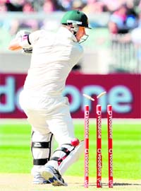 Australian captain Michael Clarke is bowled by Zaheer Khan in Melbourne on Monday