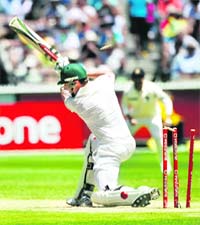 Shaun Marsh is bowled as he plays on a delivery from Umesh Yadav in Melbourne on Wednesday