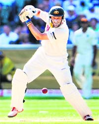 Mike Hussey cuts a ball away against India at Melbourne on Wednesday. Hussey is unbeaten on 79