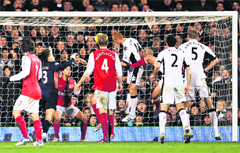 Fulham�s Bobby Zamora scores the winner against Arsenal in London on Monday. 